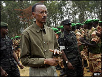 Rwandan President Paul Kagame inspects soldiers in Kigali before they were airlifted to Darfur in Sudan